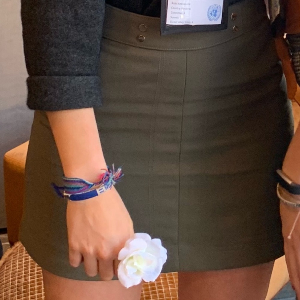 Green denim skirt with gold buttons